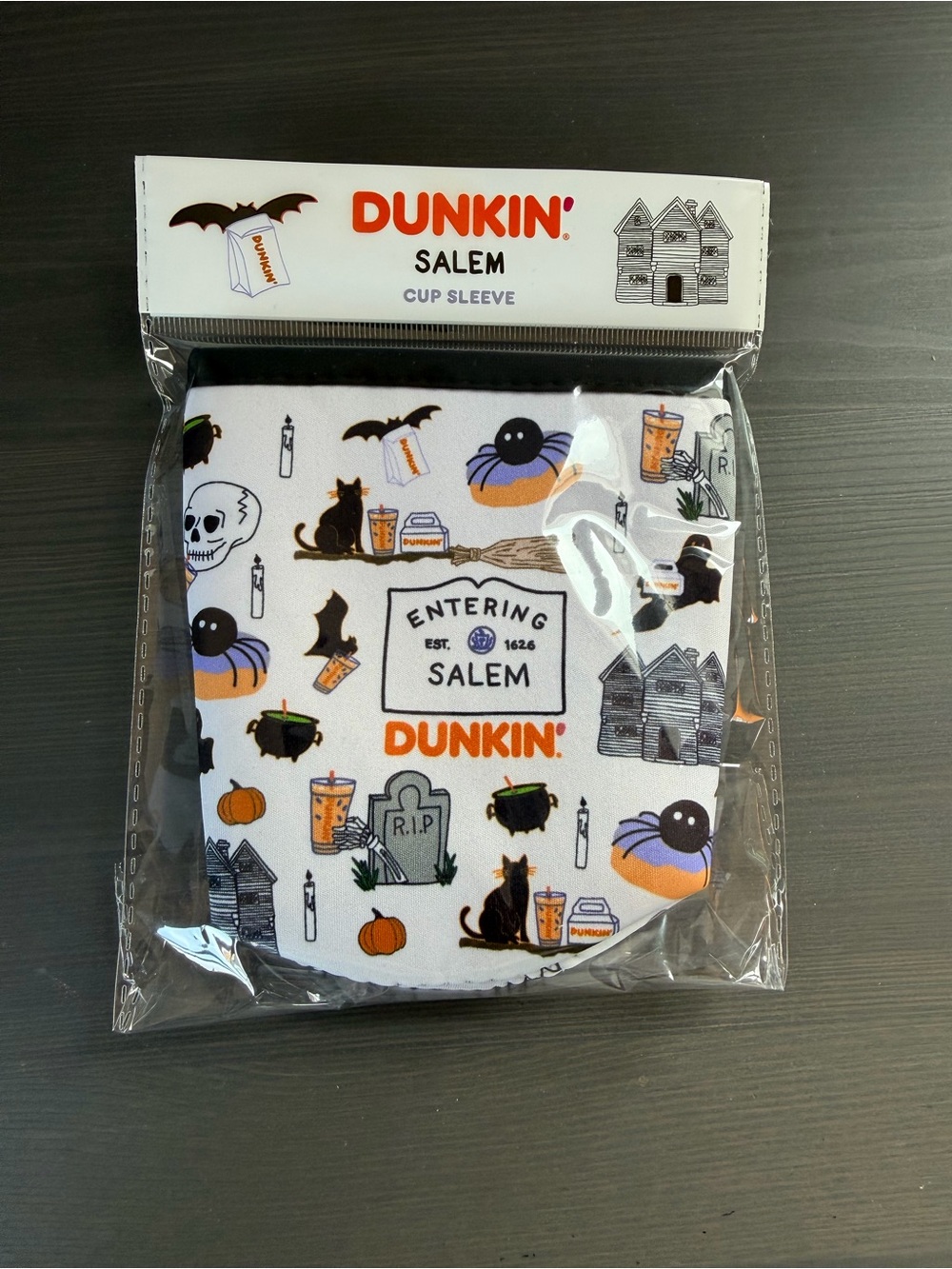 Dunkin’ Halloween 2026 Cup sleeve. White Salem Halloween Print